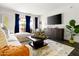 Comfortable living room featuring stylish furniture, a flat-screen TV, and access to a patio at 7350 N Via Paseo Del Sur -- # P105, Scottsdale, AZ 85258