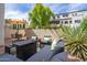 Inviting outdoor patio area with a fire pit and comfortable seating, perfect for relaxing at 7350 N Via Paseo Del Sur -- # P105, Scottsdale, AZ 85258