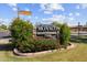 Community sign for Monaco Condominiums with well-maintained landscaping and clear signage at 7350 N Via Paseo Del Sur -- # P105, Scottsdale, AZ 85258