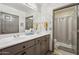 Bright bathroom features double sink vanity with ample lighting and a separate shower at 7575 E Indian Bend Rd # 1137, Scottsdale, AZ 85250