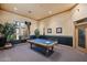 Elegant billiard room featuring a well-maintained pool table, decorative trim, and ample lighting at 7575 E Indian Bend Rd # 1137, Scottsdale, AZ 85250
