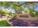 Well-manicured community signage surrounded by beautiful foliage, creating an inviting entrance at 7575 E Indian Bend Rd # 1137, Scottsdale, AZ 85250