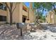 Grilling area with two charcoal grills amid landscaped grounds for outdoor enjoyment at 7575 E Indian Bend Rd # 1137, Scottsdale, AZ 85250