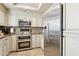 Well-equipped kitchen featuring stainless steel appliances, custom cabinetry, and modern fixtures at 7575 E Indian Bend Rd # 1137, Scottsdale, AZ 85250