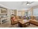 Spacious living room featuring tile floors, leather seating, and a large center table at 7575 E Indian Bend Rd # 1137, Scottsdale, AZ 85250