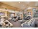 Expansive lounge area with comfortable seating, fireplace, and soaring ceilings, creating a welcoming social space at 7575 E Indian Bend Rd # 1137, Scottsdale, AZ 85250