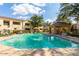 Relaxing community pool area featuring lounge chairs, umbrellas, and a covered gazebo, perfect for outdoor enjoyment at 7575 E Indian Bend Rd # 1137, Scottsdale, AZ 85250