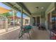 Spacious covered back patio featuring outdoor seating and grill at 7608 W Mescal St, Peoria, AZ 85345