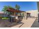 Outdoor bar and entertainment area with BBQ and play equipment at 7608 W Mescal St, Peoria, AZ 85345