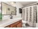 Clean bathroom featuring a vanity, decorative mirror, and shower at 7608 W Mescal St, Peoria, AZ 85345