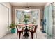 Cozy breakfast nook featuring a bay window, round table, and comfortable seating at 7608 W Mescal St, Peoria, AZ 85345