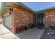 Inviting front entrance with a secure metal gate and a bench, leading to the front door at 7608 W Mescal St, Peoria, AZ 85345