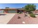 Charming single-story home featuring a well-maintained front yard, lush landscaping, and a welcoming exterior at 7608 W Mescal St, Peoria, AZ 85345