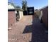 Gravel RV parking with a garage and carport for storage and vehicles at 7608 W Mescal St, Peoria, AZ 85345