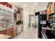 Inviting kitchen featuring granite counters, stainless steel appliances, and tiled floor at 7608 W Mescal St, Peoria, AZ 85345