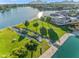 Aerial view of water feature flowing into lake with landscaped shoreline and nearby residences at 8429 E Del Camino Dr, Scottsdale, AZ 85258