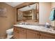 Elegant bathroom with a marble countertop, spacious vanity, and a large mirror for a luxurious feel at 8429 E Del Camino Dr, Scottsdale, AZ 85258