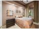 Cozy bedroom showcasing a comfortable bed, stylish decor, and plenty of natural light from the window at 8429 E Del Camino Dr, Scottsdale, AZ 85258