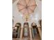 Elegant foyer showcasing a high ceiling with a unique wooden design, arched doorways, and a view of the entryway at 8429 E Del Camino Dr, Scottsdale, AZ 85258