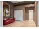 Bright living area features a red sofa and tile floor, creating a modern and inviting space at 8429 E Del Camino Dr, Scottsdale, AZ 85258