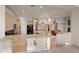 Spacious living room with kitchen island and fireplace at 8429 E Del Camino Dr, Scottsdale, AZ 85258