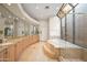 Spacious main bathroom with tub and walk-in shower at 8429 E Del Camino Dr, Scottsdale, AZ 85258