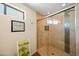 Walk-in shower with glass door and tile surround in the Primary bathroom at 8429 E Del Camino Dr, Scottsdale, AZ 85258