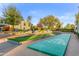 Community shuffleboard court with nearby trees and landscaping at 8429 E Del Camino Dr, Scottsdale, AZ 85258