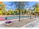 Community tennis court with shaded seating area and landscaped surroundings at 8429 E Del Camino Dr, Scottsdale, AZ 85258