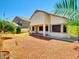 Inviting backyard featuring desert landscaping and covered patio, perfect for outdoor living at 8854 W Augusta Ave, Glendale, AZ 85305