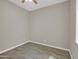 This is a spacious bedroom with wood-look tile flooring and a ceiling fan with light at 8854 W Augusta Ave, Glendale, AZ 85305