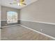 A cozy bedroom featuring a large window that offers plenty of natural light at 8854 W Augusta Ave, Glendale, AZ 85305