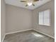 This is a spacious bedroom with wood-look tile flooring and a window with blinds at 8854 W Augusta Ave, Glendale, AZ 85305