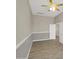 A cozy bedroom featuring an open door, ceiling fan and plenty of natural light at 8854 W Augusta Ave, Glendale, AZ 85305