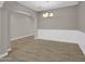 Open-concept dining room with tile flooring, white trim, and a chandelier at 8854 W Augusta Ave, Glendale, AZ 85305