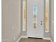Inviting front entryway with a beautiful front door with art-glass at 8854 W Augusta Ave, Glendale, AZ 85305