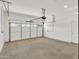 Interior view of garage with roll up door at 8854 W Augusta Ave, Glendale, AZ 85305
