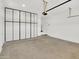 Spacious garage featuring white walls, finished floor and storage at 8854 W Augusta Ave, Glendale, AZ 85305