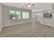 Bright living room with tile flooring, neutral walls, and large windows offering natural light at 8854 W Augusta Ave, Glendale, AZ 85305