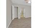 Spacious living room with tile flooring, ceiling fan, and doorways leading to other rooms at 8854 W Augusta Ave, Glendale, AZ 85305