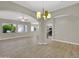 Spacious open-concept living room with tile flooring and plenty of natural light at 8854 W Augusta Ave, Glendale, AZ 85305