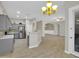 Open living space connecting the kitchen, dining, and living areas with a seamless, modern design at 8854 W Augusta Ave, Glendale, AZ 85305