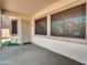Covered patio featuring concrete flooring, and exterior door at 8854 W Augusta Ave, Glendale, AZ 85305