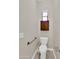 Small powder room with toilet, window and overhead cabinet at 8854 W Augusta Ave, Glendale, AZ 85305