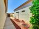 View of a clean side yard, enclosed with a block wall, offering desert landscaping at 8854 W Augusta Ave, Glendale, AZ 85305