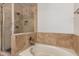 A bathtub with tile surround and glass shower is a great place to relax at 917 N Blackbird Dr, Gilbert, AZ 85234