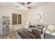 A playful bedroom features a twin bed, shelves, and window with shutters at 917 N Blackbird Dr, Gilbert, AZ 85234
