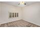 Cozy bedroom with neutral carpet and unique arched window at 917 N Blackbird Dr, Gilbert, AZ 85234