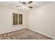 A spacious bedroom features carpet floors, ceiling fan, and window with shutters at 917 N Blackbird Dr, Gilbert, AZ 85234