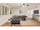 A large game room with neutral walls, vinyl floors, a ceiling fan, a pool table and a foosball table at 917 N Blackbird Dr, Gilbert, AZ 85234